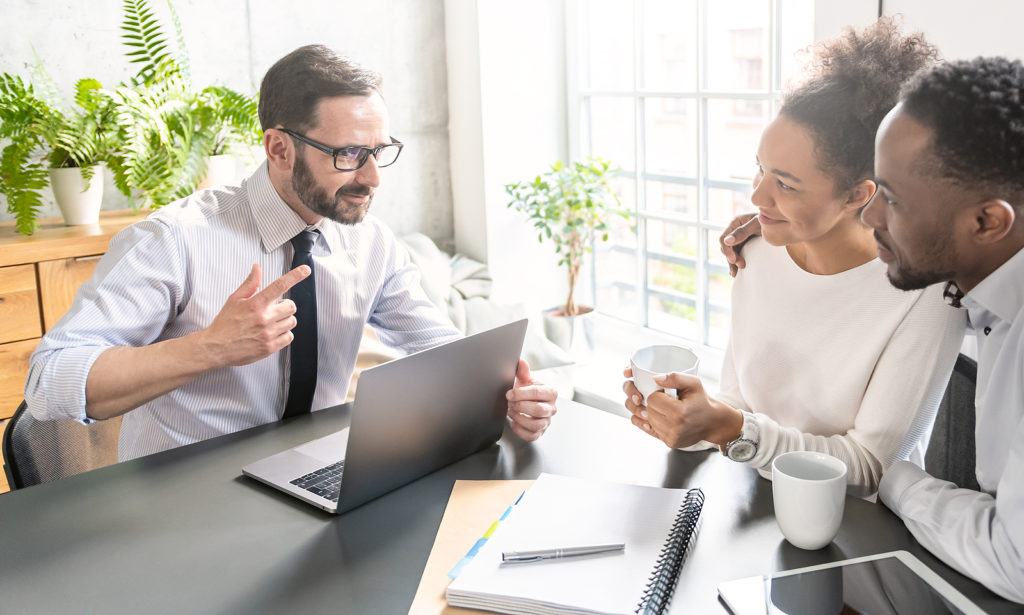 Family Couple Consultations With A Lawyer Or Insurance Agent