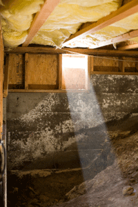 A ray of sun slanting into a crawlspace